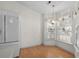 Bright breakfast nook with wood floors and lots of natural light from large windows at 1021 Dunraven Ct., Conway, SC 29527
