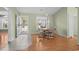 Bright dining area featuring hardwood floors and a view of the front entrance at 1021 Dunraven Ct., Conway, SC 29527