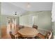 Dining area showcasing an octagon table, hardwood floors, and views into living room at 1021 Dunraven Ct., Conway, SC 29527