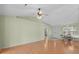 Bright living room with vaulted ceilings, hardwood floors, and views of the dining room at 1021 Dunraven Ct., Conway, SC 29527