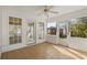 A sunroom with tile floors, white trim, and multiple windows provides a relaxing space with natural light at 1021 Dunraven Ct., Conway, SC 29527