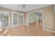 Bright sunroom with hardwood floors and glass door leading outside at 1021 Dunraven Ct., Conway, SC 29527