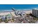 Aerial view of ocean pier and colorful houses with a parking lot at 1031 N Dogwood Dr., Surfside Beach, SC 29575