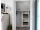 Bedroom closet with white painted built-in shelves and a hanging rod for ample clothing storage at 1031 N Dogwood Dr., Surfside Beach, SC 29575