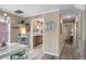 Cozy dining area with views into the kitchen, featuring wood-look floors and coastal accents at 1031 N Dogwood Dr., Surfside Beach, SC 29575