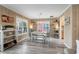 Cozy dining room featuring wood-look floors, neutral walls, and plenty of natural light at 1031 N Dogwood Dr., Surfside Beach, SC 29575