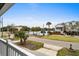 Exterior view from a covered porch looking over a landscaped yard and pond at 1031 N Dogwood Dr., Surfside Beach, SC 29575