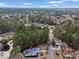 Aerial view of a neighborhood with wooded areas and a single-story home at 1061 Courtyard Dr., Conway, SC 29526