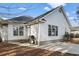 Back of a white home with a patio, grill, and windows at 1061 Courtyard Dr., Conway, SC 29526