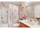 Bathroom featuring a shower-tub combo, vanity, and decorative accents at 1061 Courtyard Dr., Conway, SC 29526