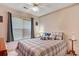 Cozy bedroom featuring a ceiling fan, window with blinds, and comfortable bedding at 1061 Courtyard Dr., Conway, SC 29526