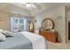 Inviting bedroom featuring a large window, ceiling fan, and well-lit vanity area at 1061 Courtyard Dr., Conway, SC 29526