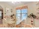 Cheerful dining area with a glass-top table, white chairs, and bright accents under a ceiling fan at 1061 Courtyard Dr., Conway, SC 29526