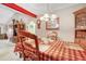 Warm dining room featuring classic decor, chandelier, and adjacent living spaces at 1061 Courtyard Dr., Conway, SC 29526