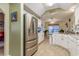 Bright kitchen with white cabinetry, stainless steel refrigerator, and adjacent breakfast nook at 1061 Courtyard Dr., Conway, SC 29526