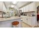 Bright kitchen featuring tile backsplash, light countertops and cabinetry, and stainless steel appliances at 1061 Courtyard Dr., Conway, SC 29526