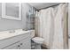 Bathroom featuring a vanity, toilet, and shower with a flamingo shower curtain, offering a clean and functional space at 109 Clemson Rd., Conway, SC 29526