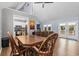 Open dining area with vaulted ceiling, natural light, and seamless access to the kitchen and outdoor deck at 109 Clemson Rd., Conway, SC 29526