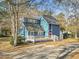 Two-story home with blue siding and a front porch and yard at 109 Clemson Rd., Conway, SC 29526