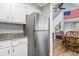 Modern kitchen with stainless steel refrigerator and ample storage space, adjacent to the dining area at 109 Clemson Rd., Conway, SC 29526