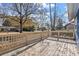 Spacious outdoor porch with wooden decking and classic railings overlooking the neighborhood street at 109 Clemson Rd., Conway, SC 29526