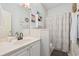 Neutral bathroom features a single sink vanity and shower with decorative curtain at 109 Jessica Lakes Dr., Conway, SC 29526