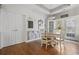 Breakfast nook features a wooden table, wainscoting, and access to outdoor views at 109 Jessica Lakes Dr., Conway, SC 29526