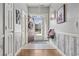 Inviting entryway featuring tile and hardwood flooring, decorative wall accents and natural lighting at 109 Jessica Lakes Dr., Conway, SC 29526