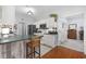 Functional kitchen featuring white cabinets, dark countertops, a breakfast bar, and stainless steel appliances at 109 Jessica Lakes Dr., Conway, SC 29526