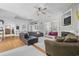 Bright and airy living room featuring hardwood floors, a fireplace, and an open layout at 109 Jessica Lakes Dr., Conway, SC 29526