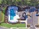 Aerial view of community pool, seating, landscaping, and ample parking at 1091 Forest Bend Dr., Calabash, NC 28467