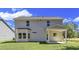 Home featuring a well-maintained lawn and covered patio at 1091 Forest Bend Dr., Calabash, NC 28467