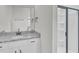 Bright bathroom featuring a modern vanity with granite countertop and framed glass shower with built-in shelving at 1091 Forest Bend Dr., Calabash, NC 28467