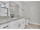 Stylish bathroom features granite countertops, white cabinets, and a large mirror at 1091 Forest Bend Dr., Calabash, NC 28467