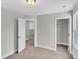 Bedroom with carpeted floors and neutral walls shows closet and doorway leading to adjoining rooms at 1091 Forest Bend Dr., Calabash, NC 28467