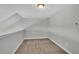 Finished bonus room with neutral carpeting, sloped ceilings, and ample natural light at 1091 Forest Bend Dr., Calabash, NC 28467