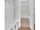 Cozy entryway featuring built-in bench seating and storage, leading to carpeted room at 1091 Forest Bend Dr., Calabash, NC 28467