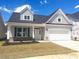 Charming new construction home with gray siding, a two-car garage, and a well-manicured front yard at 1091 Forest Bend Dr., Calabash, NC 28467
