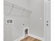 Practical laundry room with wire shelving and hookups for washer and dryer at 1091 Forest Bend Dr., Calabash, NC 28467