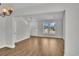Spacious living room with hardwood floors and large windows offering plenty of natural light at 1091 Forest Bend Dr., Calabash, NC 28467