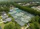 Aerial view of multiple tennis courts surrounded by lush greenery at 1110 Links Rd., Myrtle Beach, SC 29575