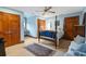 Bedroom with a four poster bed, blue walls, and wood trim at 1110 Links Rd., Myrtle Beach, SC 29575