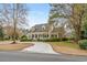 Inviting traditional home featuring a welcoming front porch and a circular driveway at 1110 Links Rd., Myrtle Beach, SC 29575