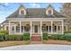 The porch of this charming home provides an idyllic entry, showcasing the home's appeal at 1110 Links Rd., Myrtle Beach, SC 29575