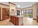 Kitchen featuring wooden cabinets, stainless steel appliances, island with seating, and breakfast area at 1110 Links Rd., Myrtle Beach, SC 29575