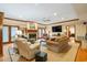 Spacious living room featuring a fireplace, plush seating, ceiling fan and hardwood floors at 1110 Links Rd., Myrtle Beach, SC 29575