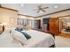 View of the main bedroom showcasing natural light, ceiling fan, and access to the ensuite at 1110 Links Rd., Myrtle Beach, SC 29575