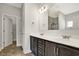 Bathroom with double sink vanity, large mirror, and tiled flooring at 1111 Forest Bend Dr., Calabash, NC 28467