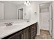 Bathroom featuring a double vanity, light fixtures, and an open door to the toilet and shower at 1111 Forest Bend Dr., Calabash, NC 28467