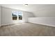 Bright bedroom with carpeted floors and natural light from the double windows overlooking a yard at 1111 Forest Bend Dr., Calabash, NC 28467